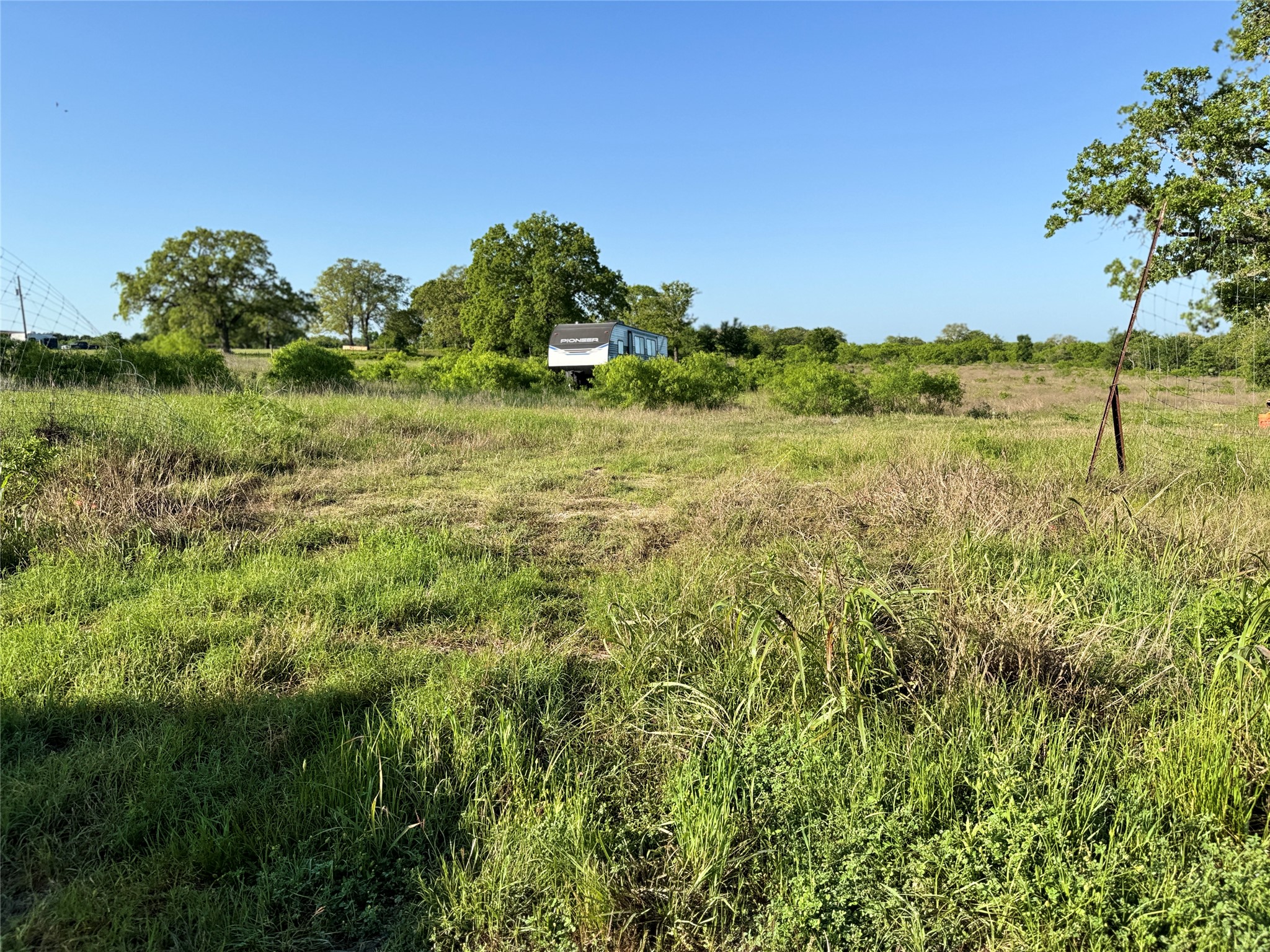 6641 Taylorsville Road Dale, TX 78616 - Photo 4 of 24 a view of a garden with a lake