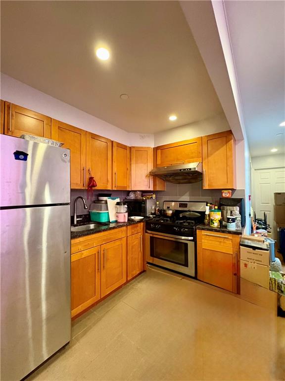 78 Bay 22nd Street, Unit 4 Brooklyn, NY 11214 - Photo 3 of 9 a kitchen with stainless steel appliances granite countertop a stove top oven a sink dishwasher a refrigerator and white cabinets with wooden floor