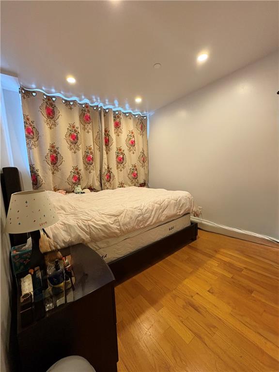 78 Bay 22nd Street, Unit 4 Brooklyn, NY 11214 - Photo 5 of 9 a bedroom with a bed and a walk in closet