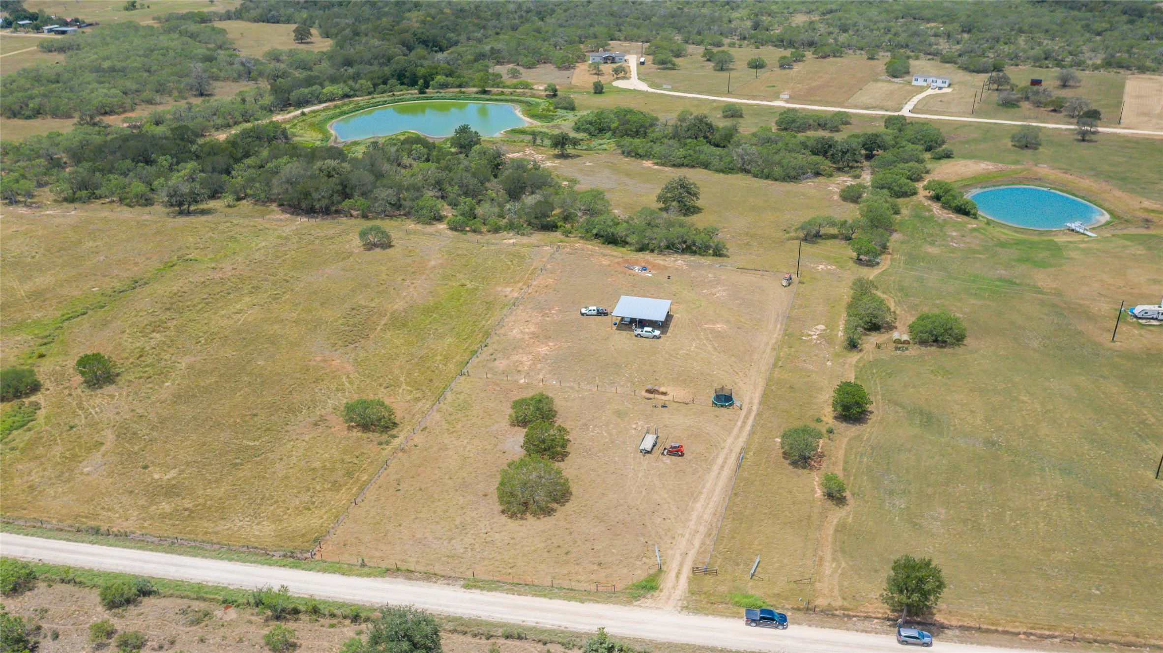 736 Cr 421 Road Waelder, TX 78959 - Photo 1 of 9 Aerial view of property's location with rural landscape and a large body of water