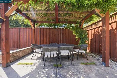 a view of a patio with a chairs and tables