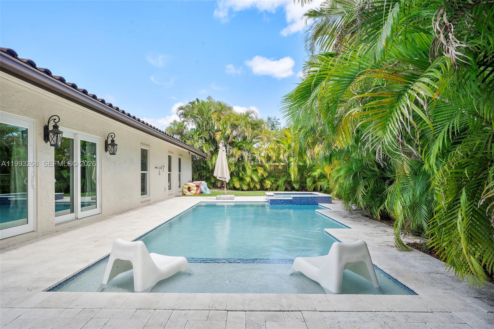 11798 Southwest 32nd Street Miami, FL 33165 - Photo 2 of 31 a view of a patio with swimming pool table and chairs