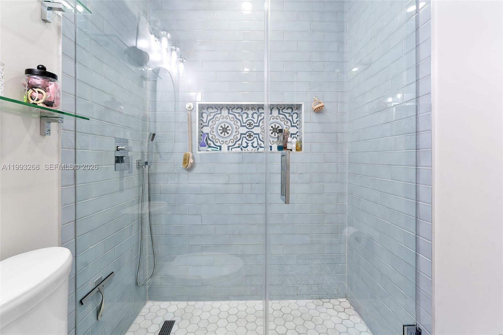 11798 Southwest 32nd Street Miami, FL 33165 - Photo 25 of 31 a bathroom with a shower toilet and sink