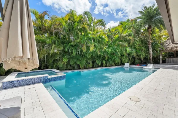 a view of a backyard with potted plants