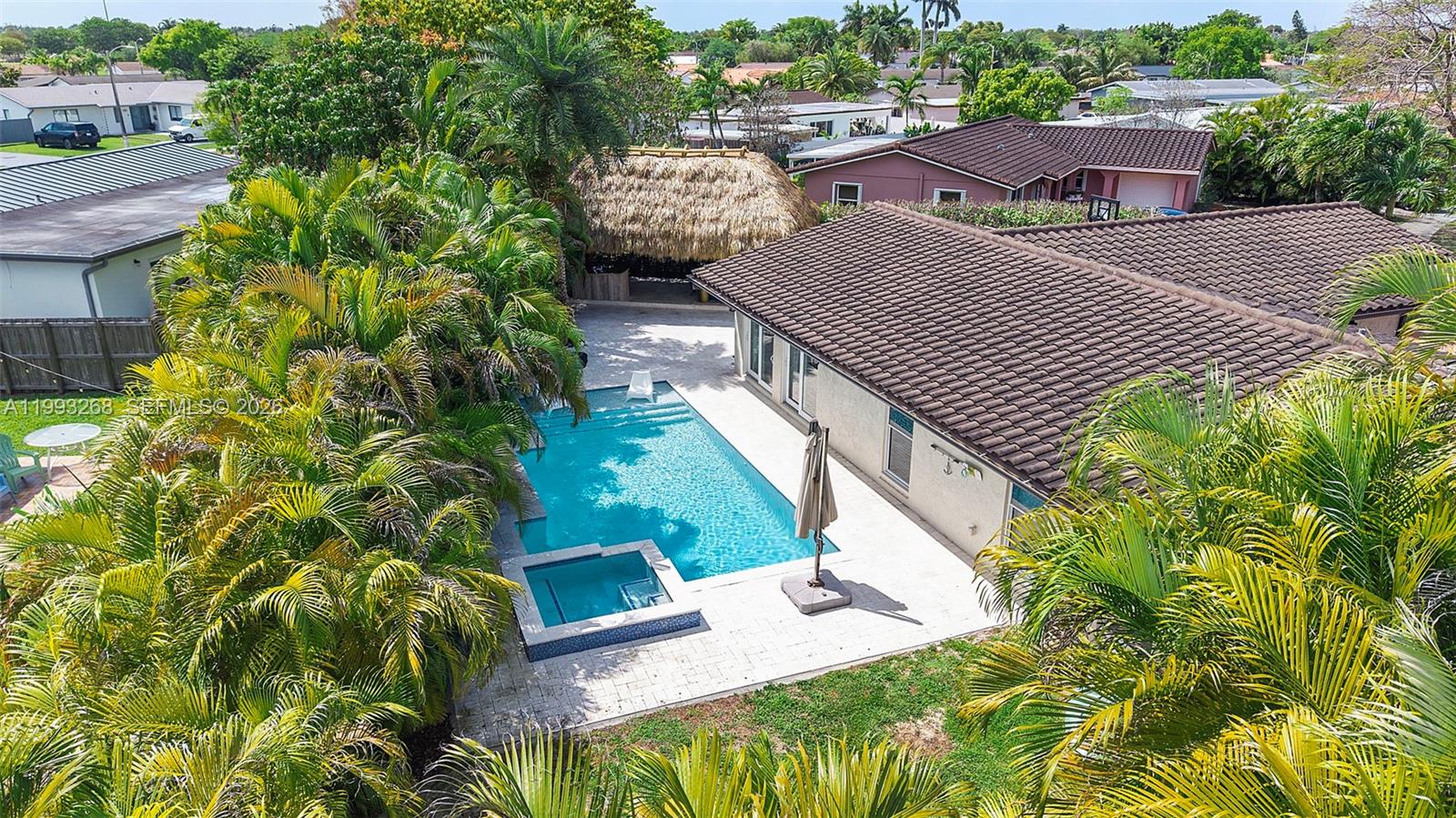 11798 Southwest 32nd Street Miami, FL 33165 - Photo 4 of 31 a view of a patio with table and chairs and potted plants