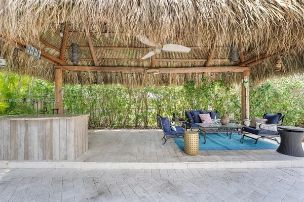 a view of a back yard of the house and trees in the background