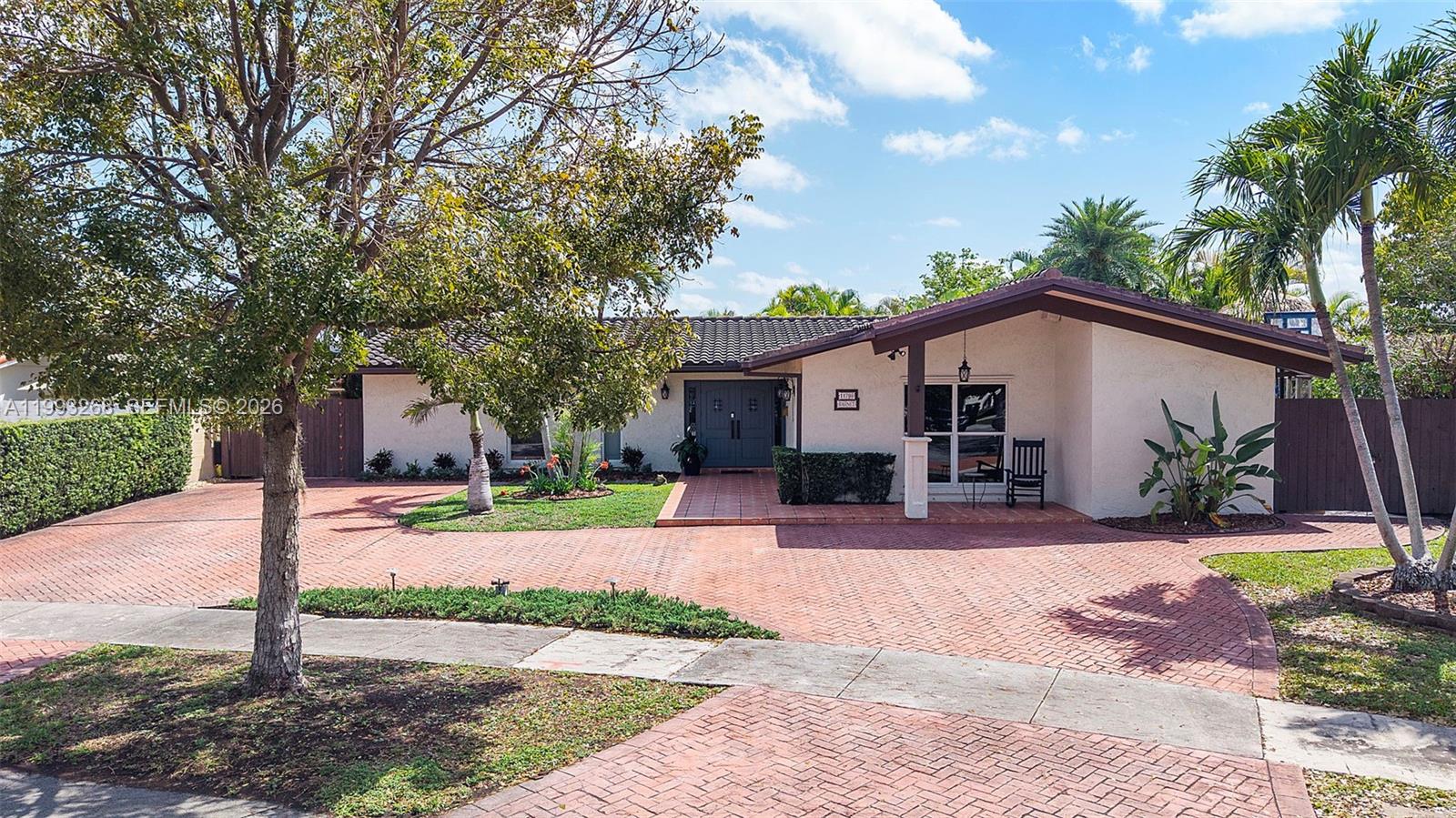 11798 Southwest 32nd Street Miami, FL 33165 - Photo 6 of 31 a front view of house with yard and green space