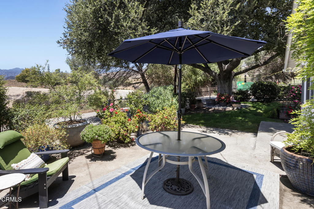 3624 Leilani Way Altadena, CA 91001 - Photo 12 of 18 a view of a backyard with table and chairs under an umbrella