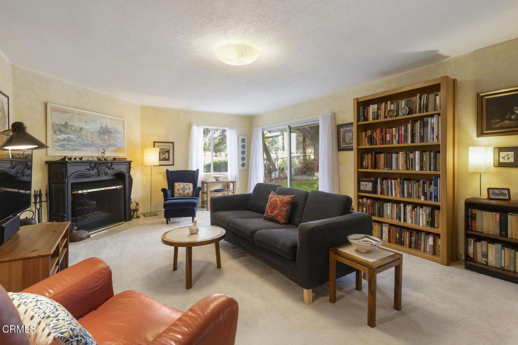 3624 Leilani Way Altadena, CA 91001 - Photo 3 of 18 a living room with furniture and a book shelf