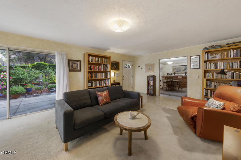 3624 Leilani Way Altadena, CA 91001 - Photo 4 of 18 a living room with furniture and a book shelf