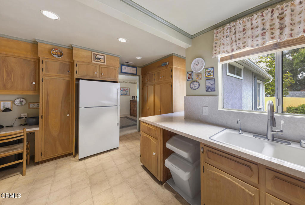 3624 Leilani Way Altadena, CA 91001 - Photo 7 of 18 a kitchen with refrigerator cabinets and a sink