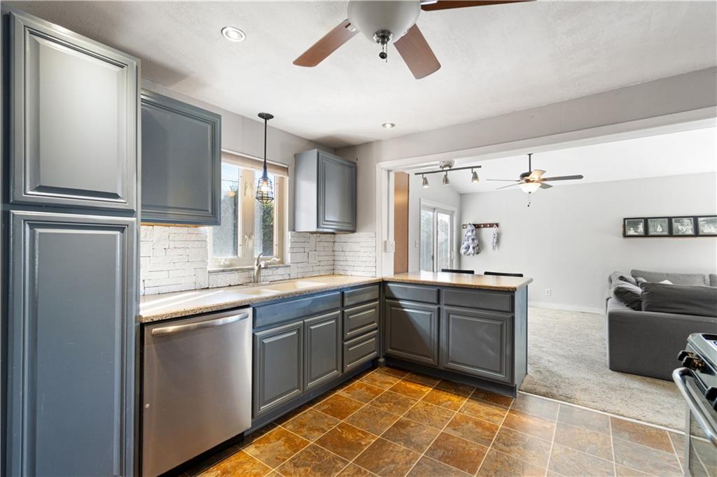 356 Spring Valley Road Pittsburgh, PA 15243 - Photo 12 of 36 a kitchen with a sink appliances and cabinets
