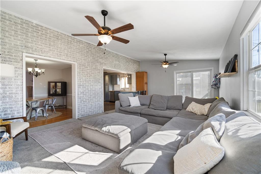 356 Spring Valley Road Pittsburgh, PA 15243 - Photo 18 of 36 a living room with furniture and a wooden floor