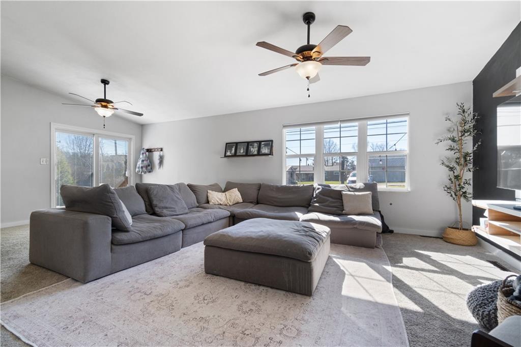 356 Spring Valley Road Pittsburgh, PA 15243 - Photo 19 of 36 a living room with furniture ceiling fan and a rug