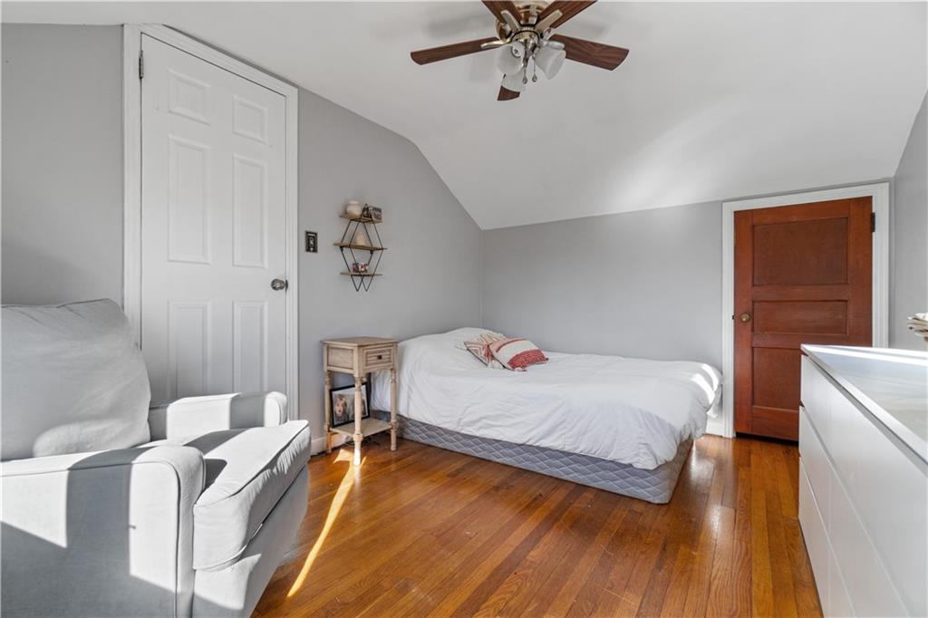 356 Spring Valley Road Pittsburgh, PA 15243 - Photo 24 of 36 a bedroom with a bed and a chandelier