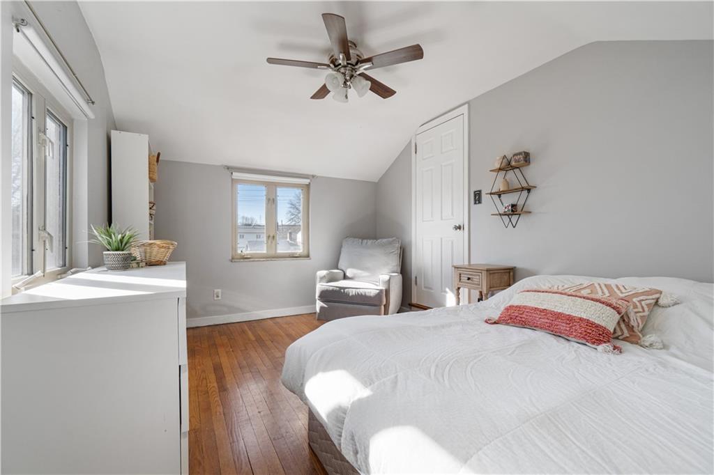 356 Spring Valley Road Pittsburgh, PA 15243 - Photo 25 of 36 a bedroom with a bed and a chandelier