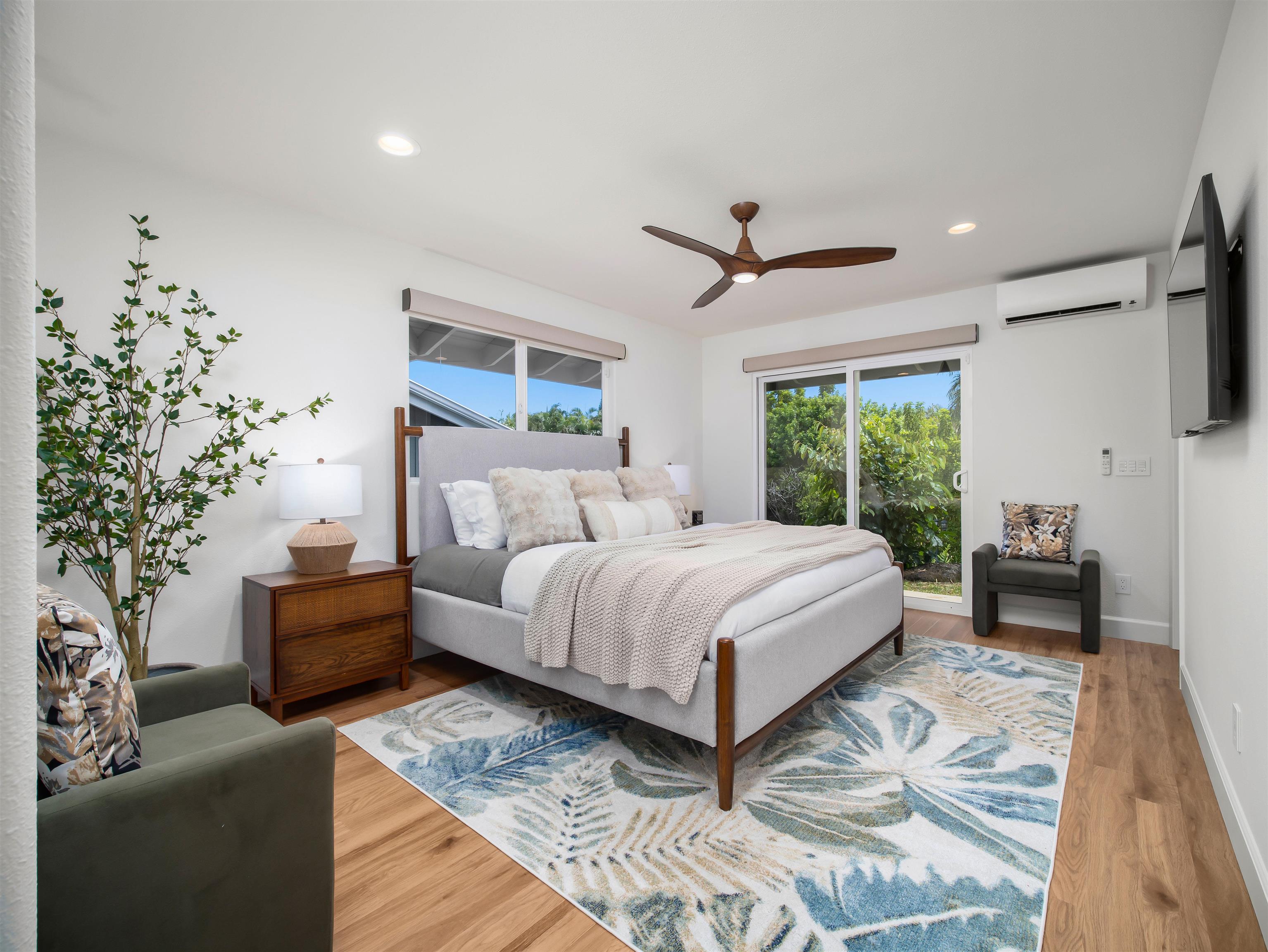 50 Eono Place Haiku, HI 96708 - Photo 19 of 50 a spacious bedroom with a large bed and a couch