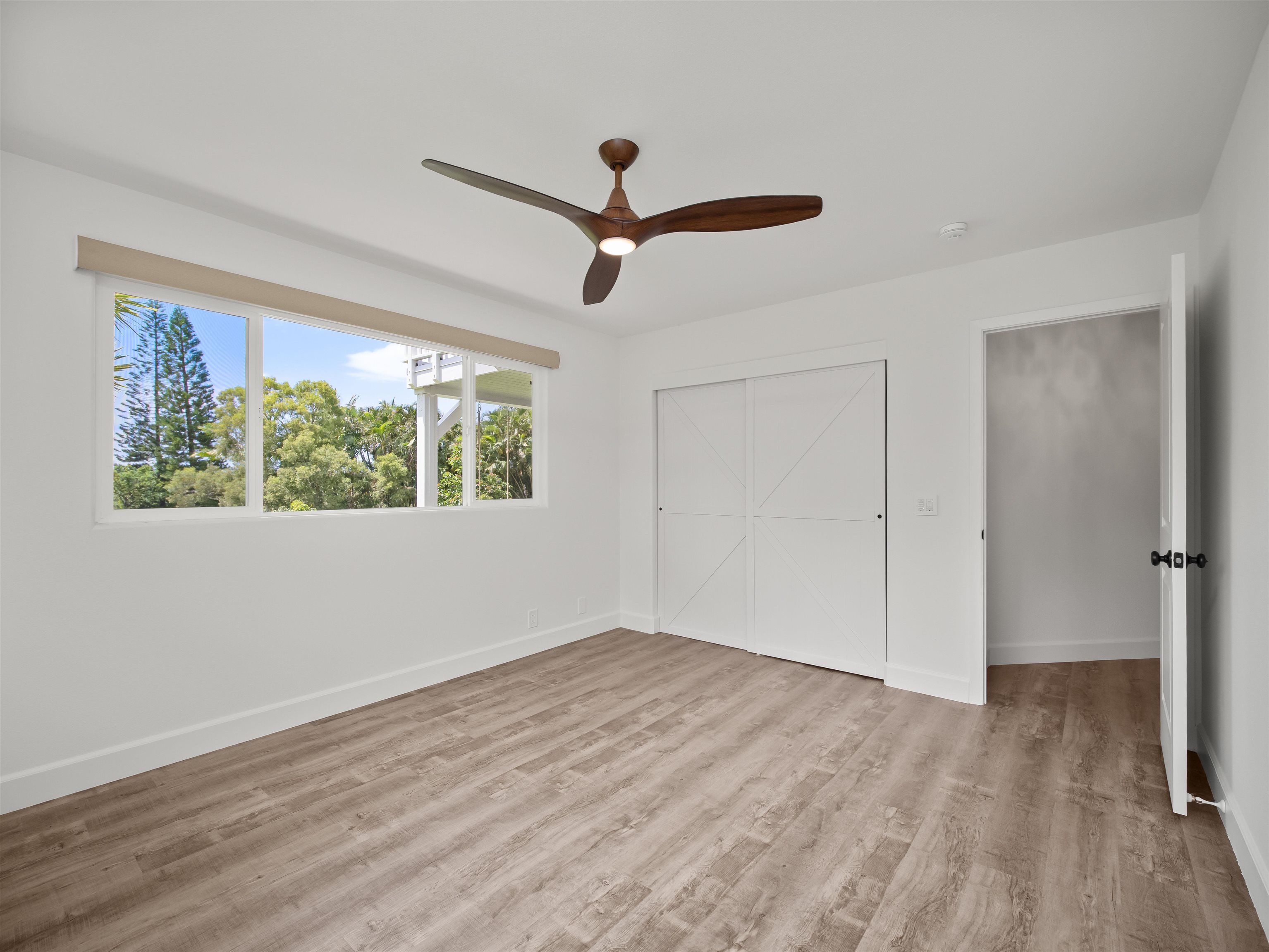 50 Eono Place Haiku, HI 96708 - Photo 33 of 50 wooden floor in an empty room with a window