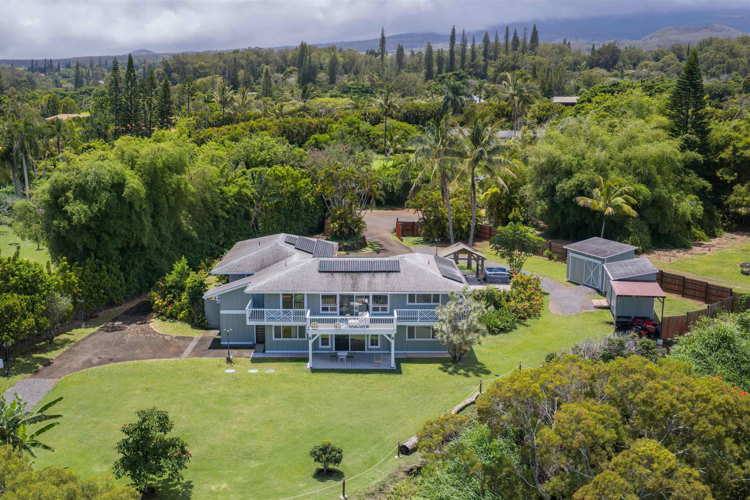 50 Eono Place Haiku, HI 96708 - Photo 47 of 50 an aerial view of a house with a garden and lake view
