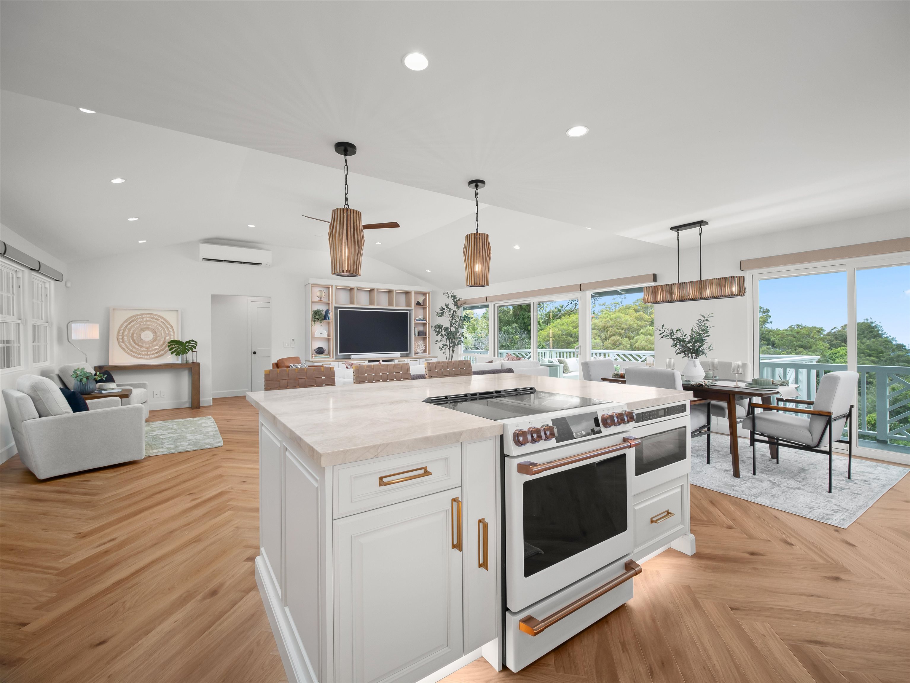 50 Eono Place Haiku, HI 96708 - Photo 5 of 50 a open kitchen with stainless steel appliances a stove top oven a sink dishwasher a dining table and chairs with wooden floor