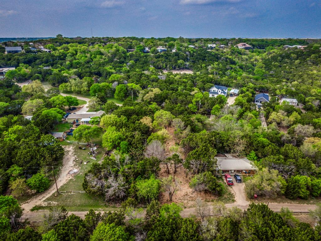 4923 Shining Star Trail Rio Vista, TX 76093 - Photo 10 of 15 Bird's eye view featuring a wooded view