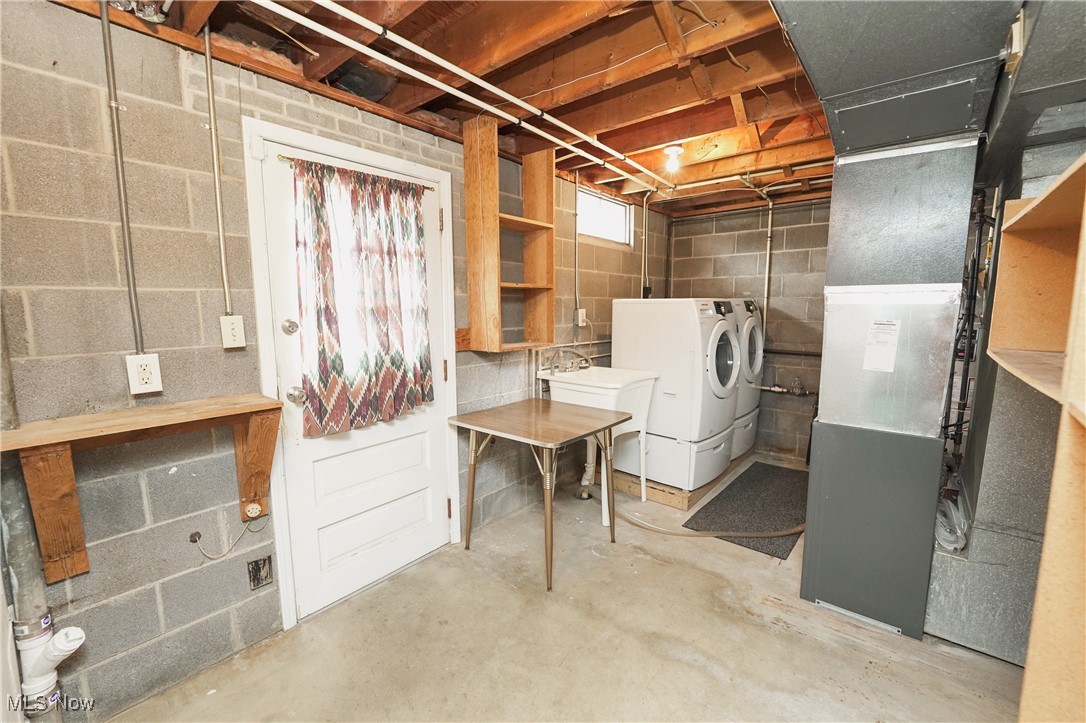 2674 Smith Road Fairlawn, OH 44333 - Photo 28 of 31 Below grade area featuring a sink and washer and clothes dryer