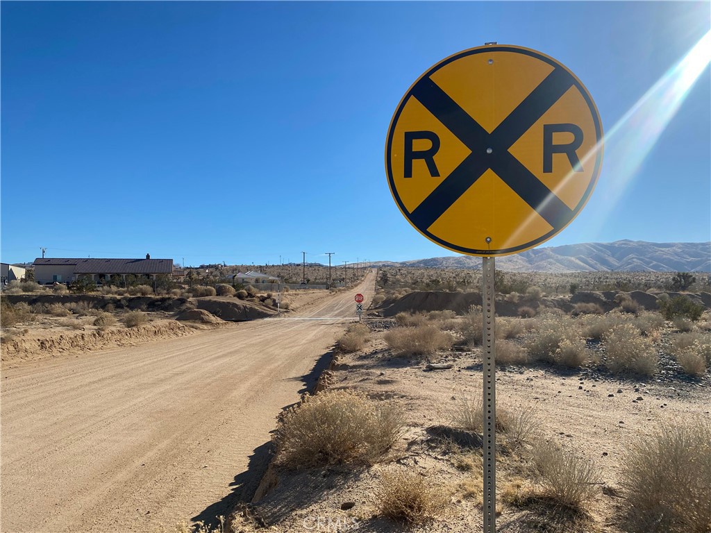 1 Tussing Ranch Road Apple Valley, CA 92308 - Photo 8 of 18 a view of a wooden floor and a building in the background
