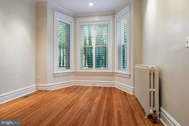 a kitchen with a sink a counter top space and stainless steel appliances