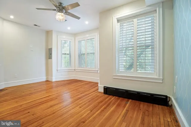 a view of a balcony with furniture and wooden deck