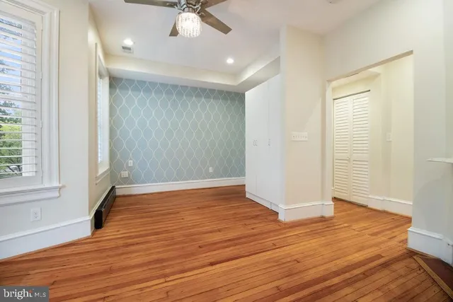 a view of a chair and tables in the patio