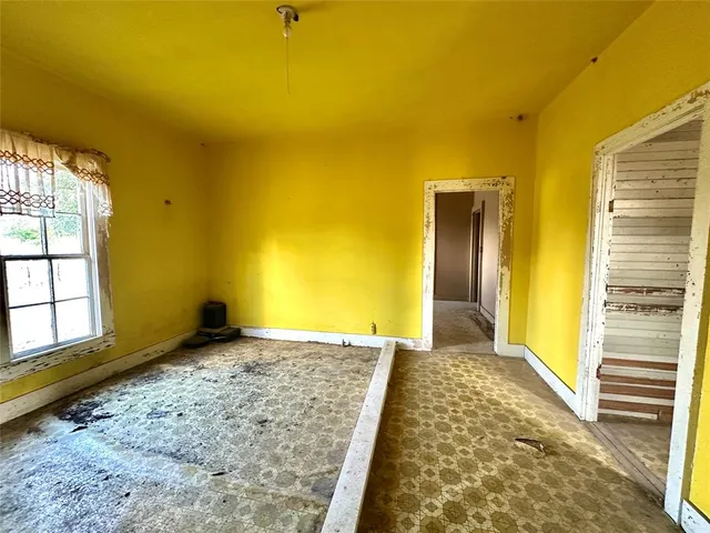 a view of an empty room and window
