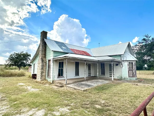 a view of a house with a swimming pool