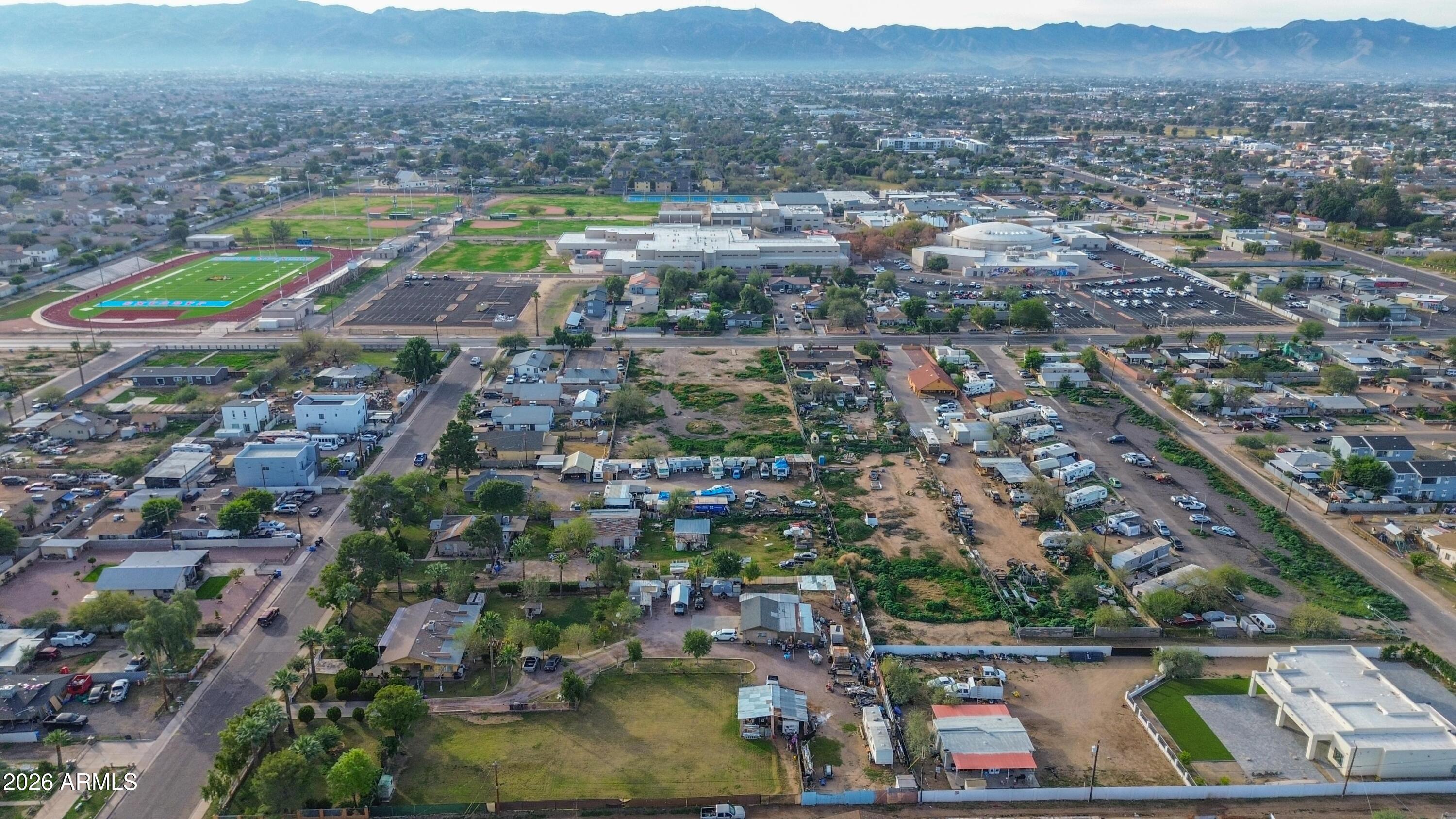 832 East Roeser Road Phoenix, AZ 85040 - Photo 15 of 47 an aerial view of residential houses with outdoor space and swimming pool