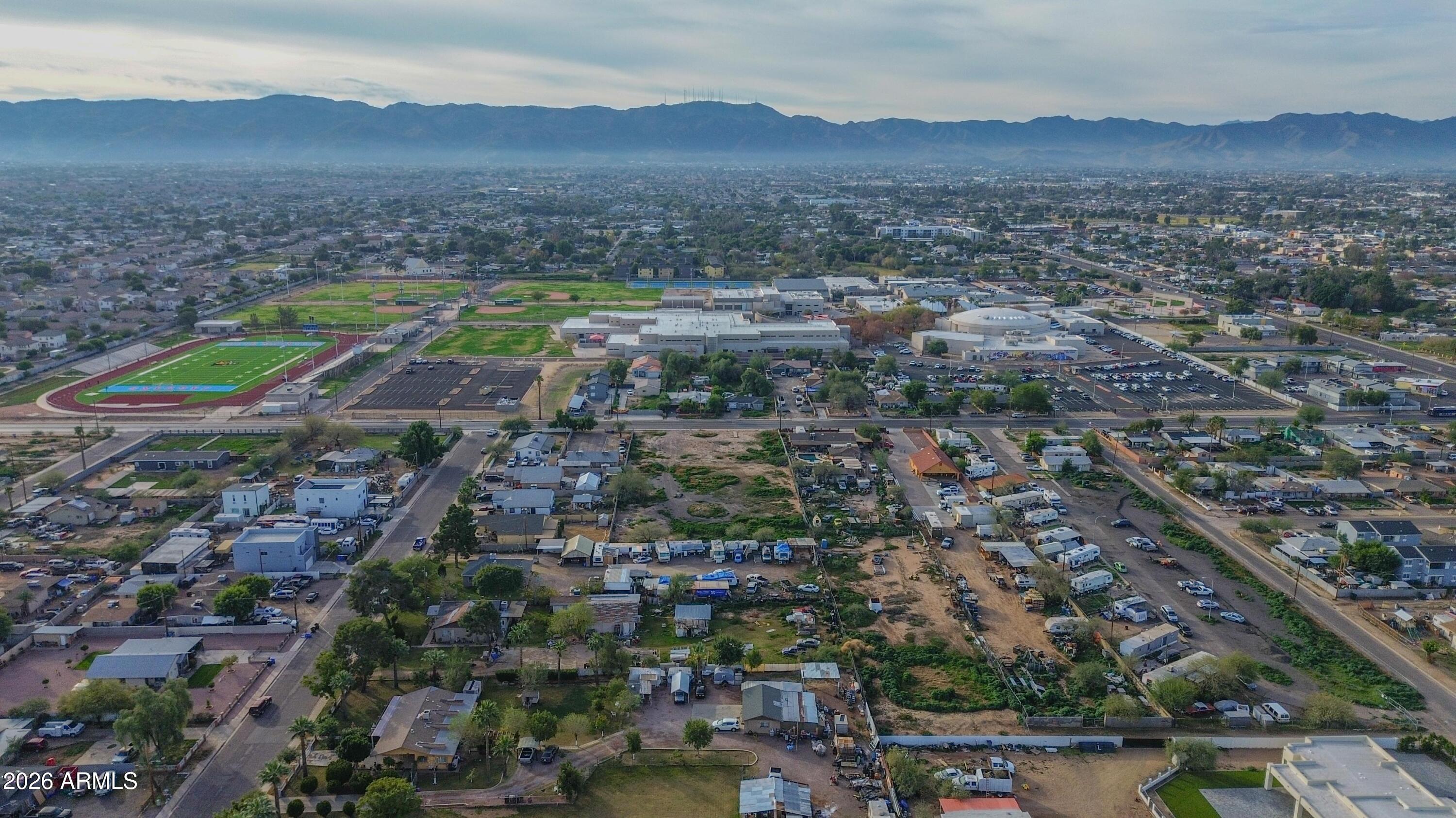 832 East Roeser Road Phoenix, AZ 85040 - Photo 16 of 47 an aerial view of residential houses with outdoor space