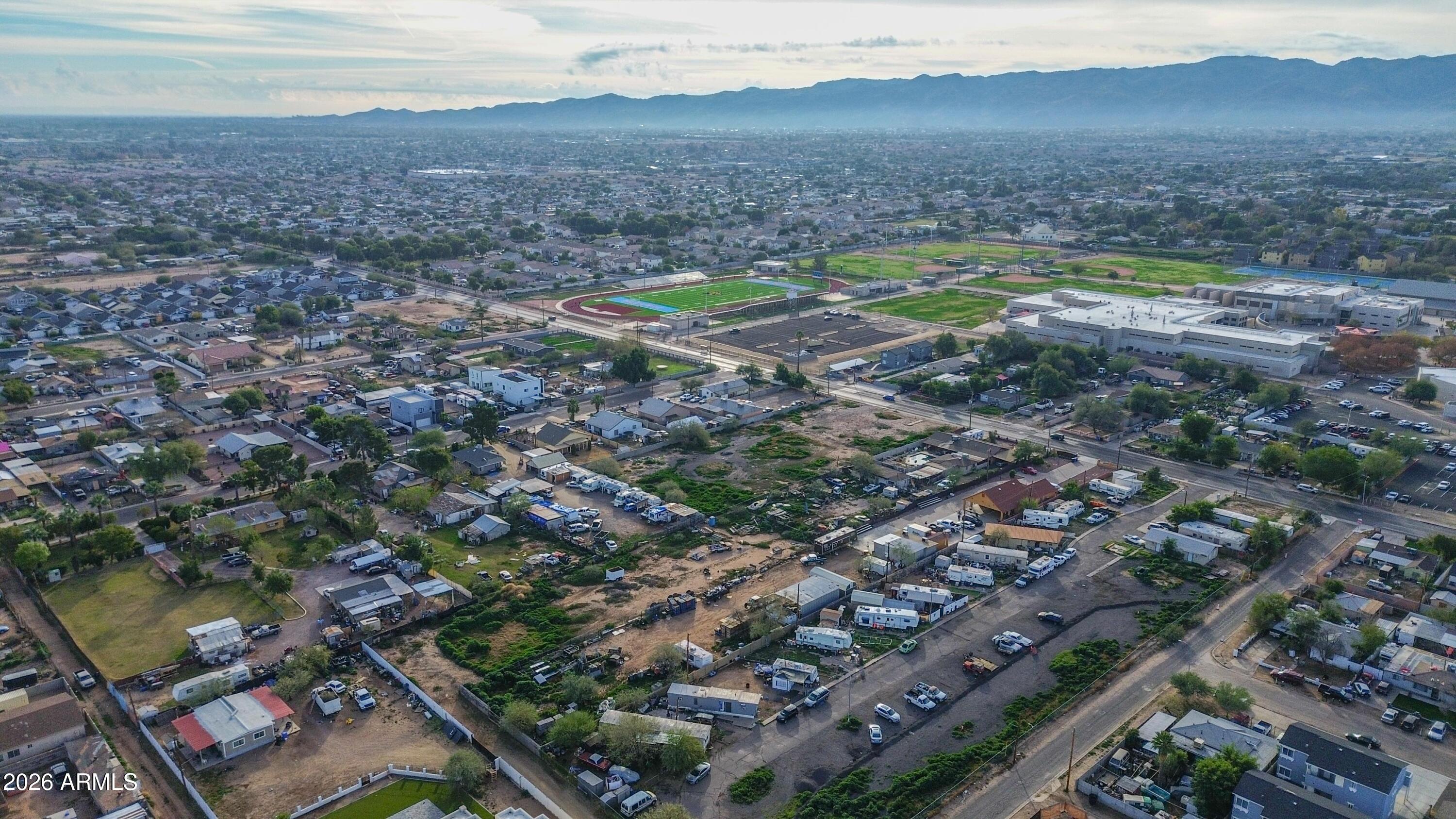 832 East Roeser Road Phoenix, AZ 85040 - Photo 18 of 47 an aerial view of residential houses with outdoor space