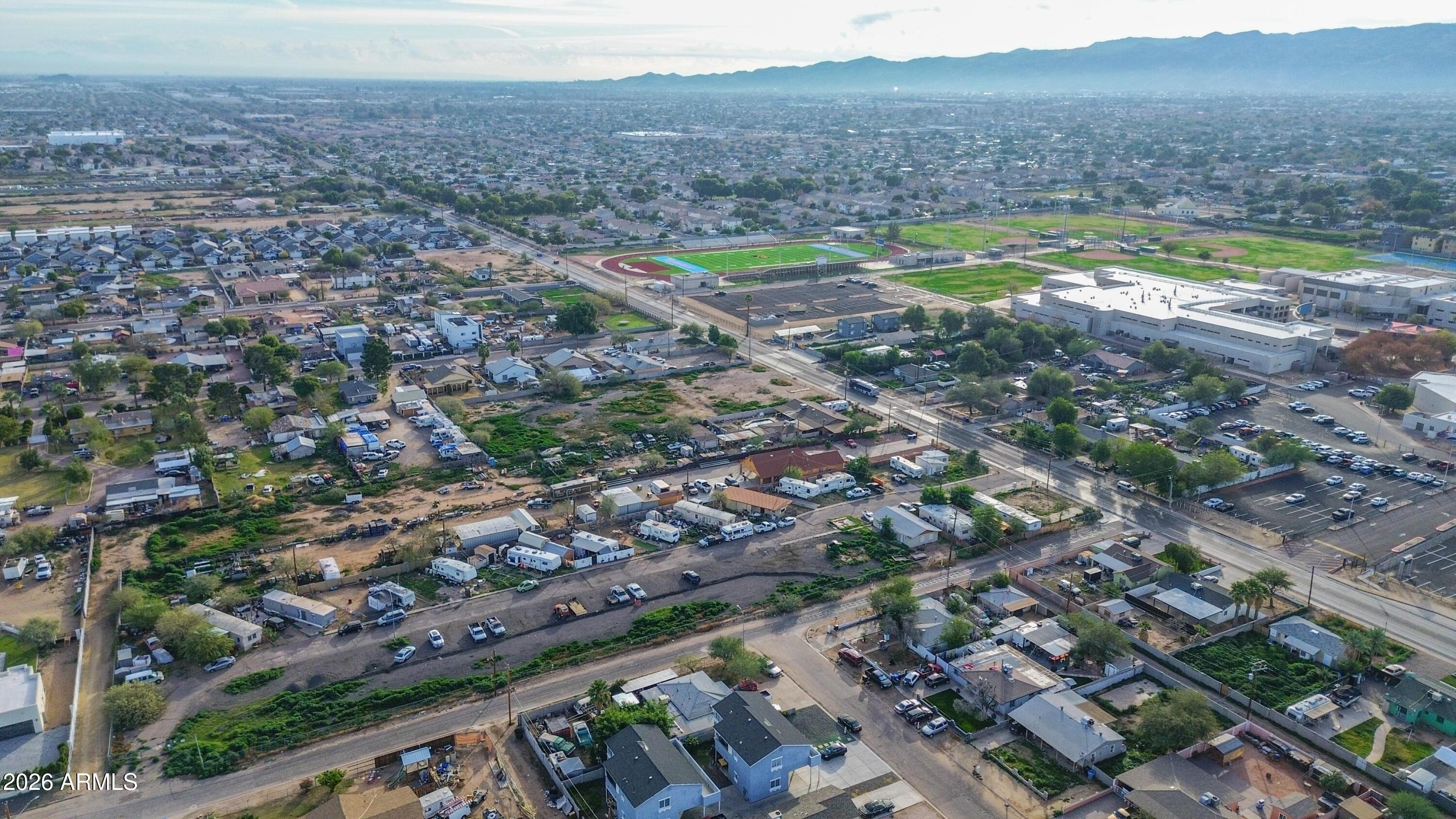832 East Roeser Road Phoenix, AZ 85040 - Photo 20 of 47 an aerial view of a residential houses with a yard and lake view