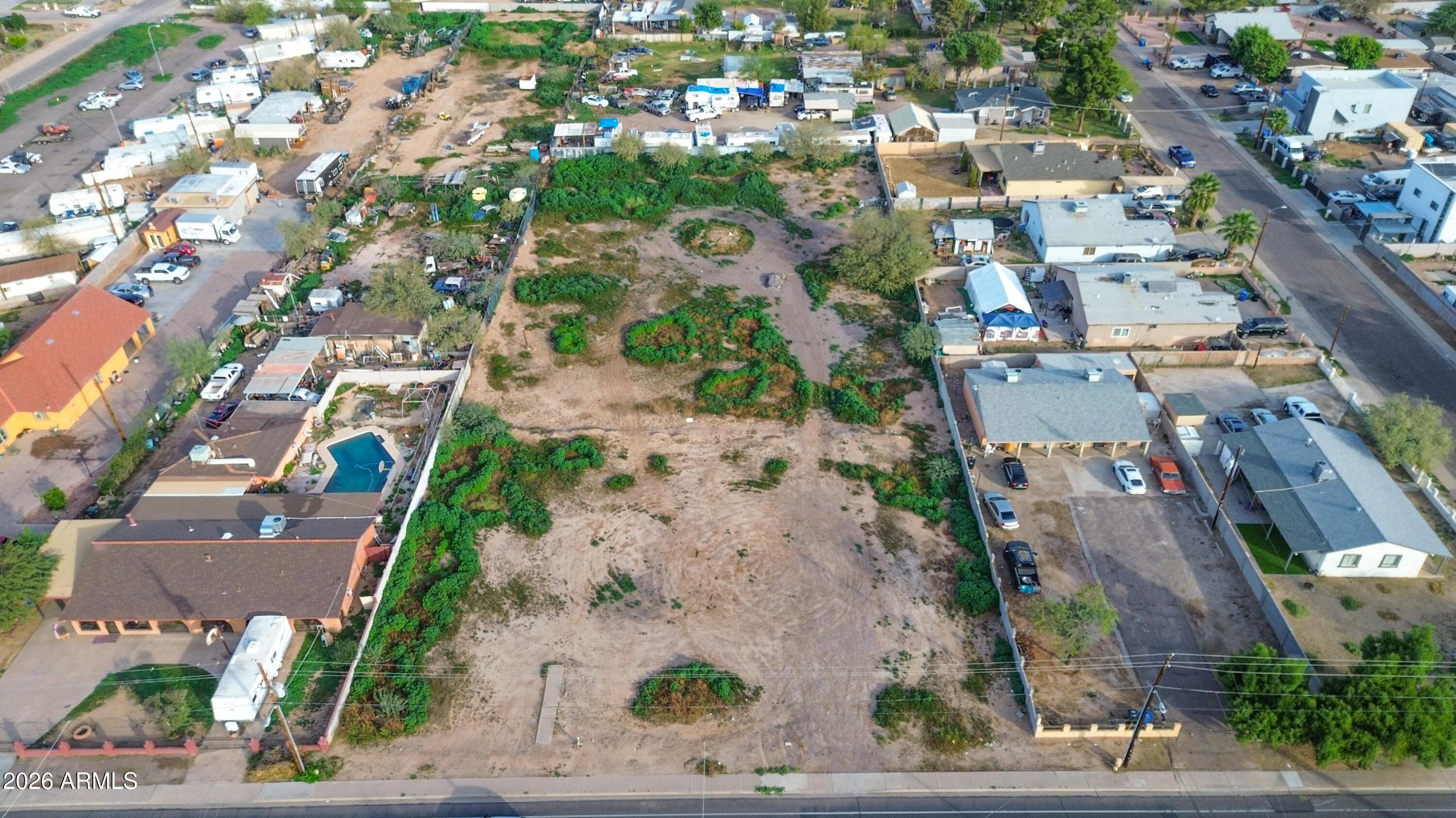 832 East Roeser Road Phoenix, AZ 85040 - Photo 30 of 47 an aerial view of residential houses with outdoor space