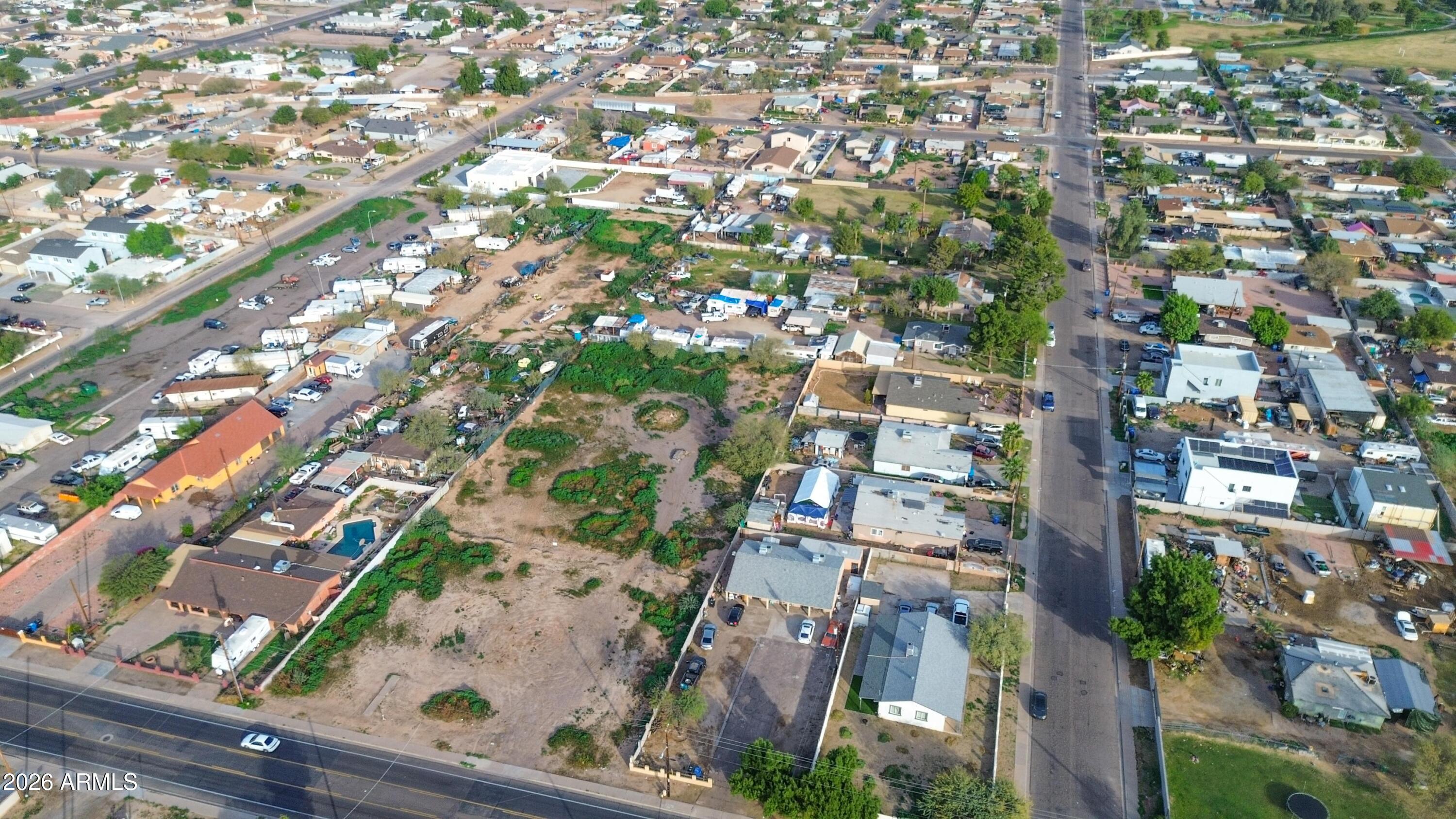 832 East Roeser Road Phoenix, AZ 85040 - Photo 33 of 47 an aerial view of residential houses with outdoor space