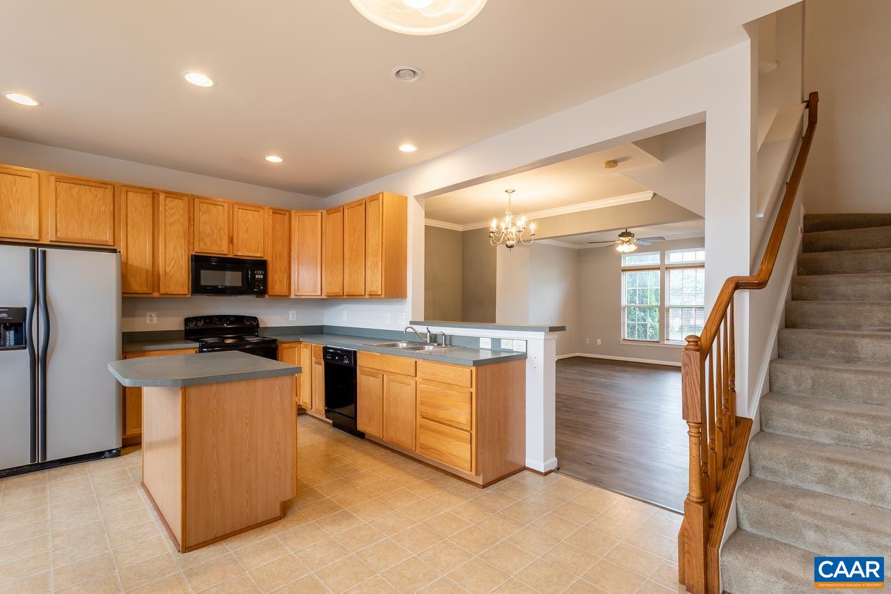 325 Rolkin Road Charlottesville, VA 22911 - Photo 14 of 32 a kitchen with granite countertop counter top space a sink stainless steel appliances and cabinets