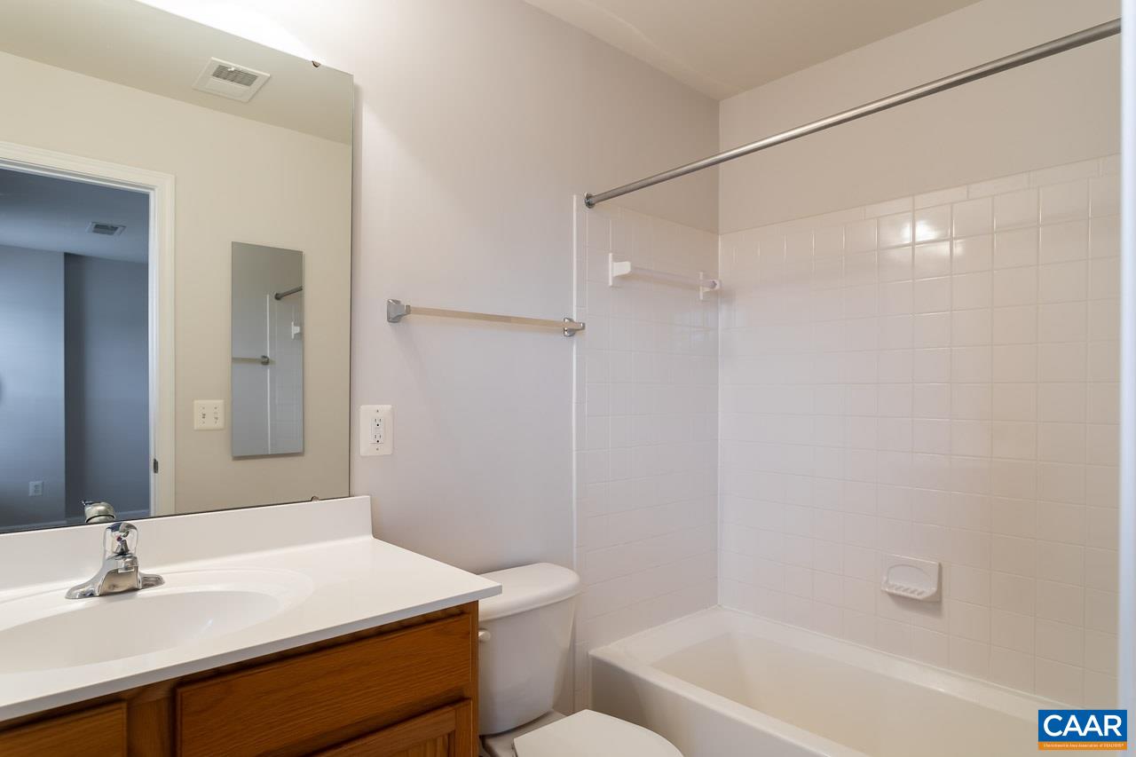 325 Rolkin Road Charlottesville, VA 22911 - Photo 19 of 32 a bathroom with a sink a toilet and shower
