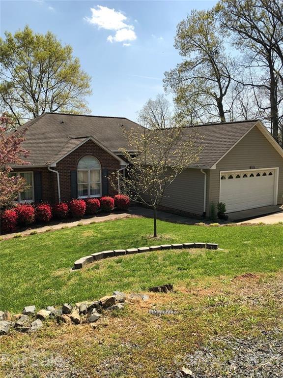 22382 Oakwood Road Albemarle, NC 28001 - Photo 1 of 21 a front view of a house with a yard