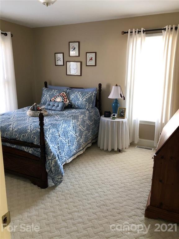 22382 Oakwood Road Albemarle, NC 28001 - Photo 12 of 21 a bed room with a bed and a couch