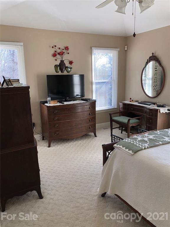 22382 Oakwood Road Albemarle, NC 28001 - Photo 15 of 21 a living room with furniture a flat screen tv and a window