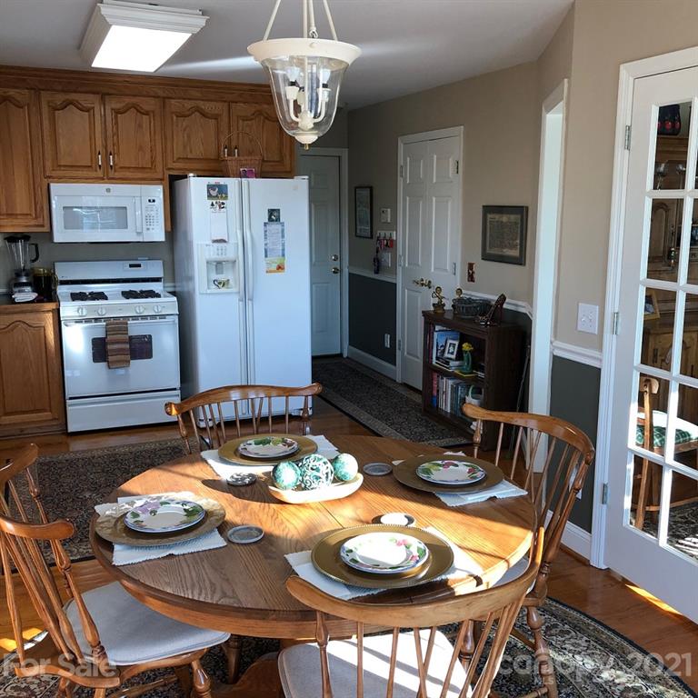 22382 Oakwood Road Albemarle, NC 28001 - Photo 17 of 21 a view of a dining room with furniture