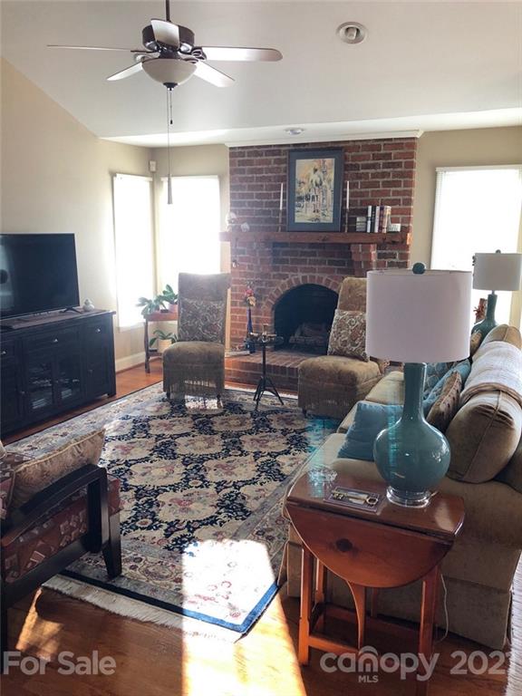 22382 Oakwood Road Albemarle, NC 28001 - Photo 5 of 21 a living room with furniture and a fireplace