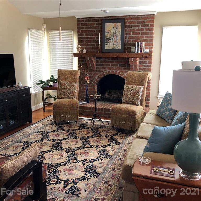 22382 Oakwood Road Albemarle, NC 28001 - Photo 6 of 21 a living room with furniture and a fireplace