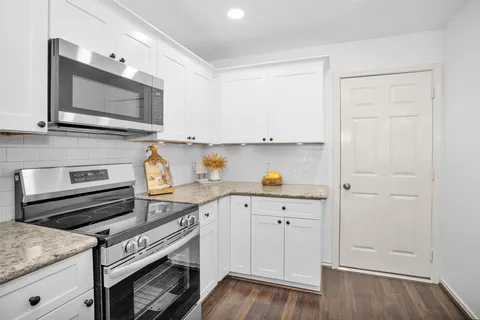 a kitchen with a stove and a microwave