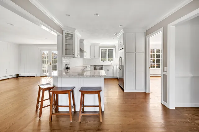 a view of a dining room with furniture and wooden floor