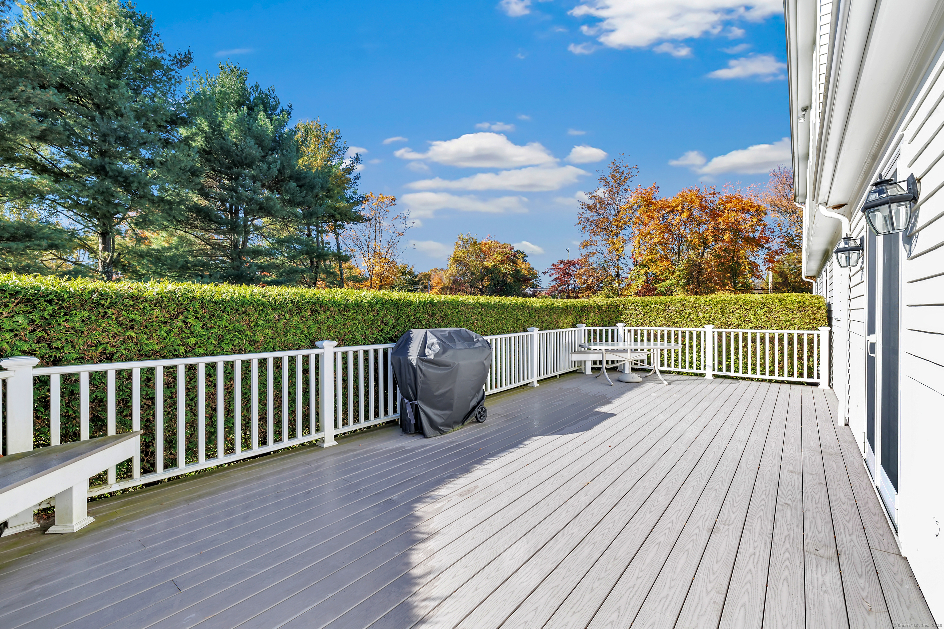 41 Butternut Lane Fairfield, CT 06890 - Photo 16 of 33 a view of balcony with wooden floor and fence