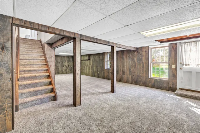 a view of an empty room with stairs